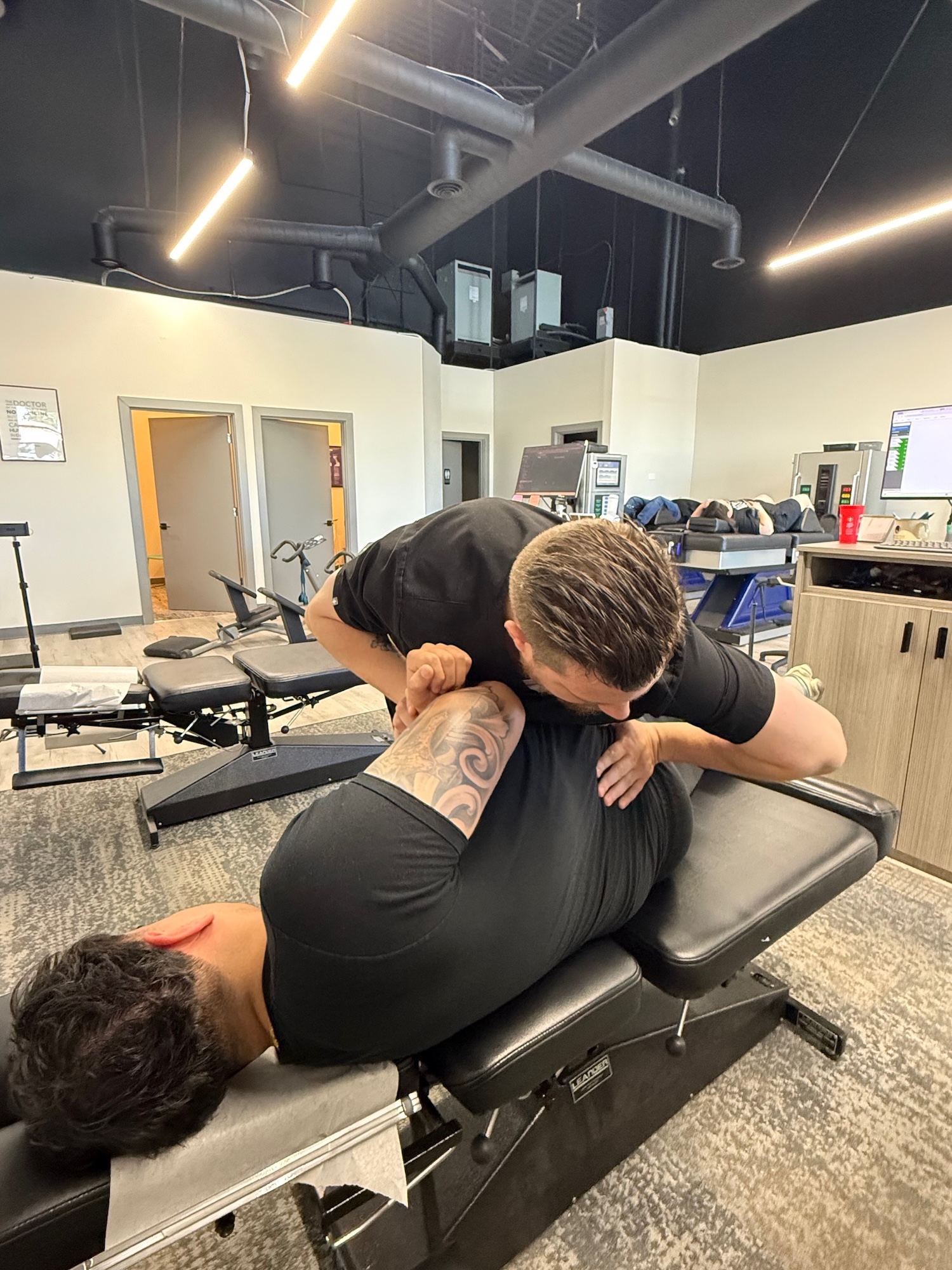 Chiropractor examining a car accident patient at Chiro 1st
