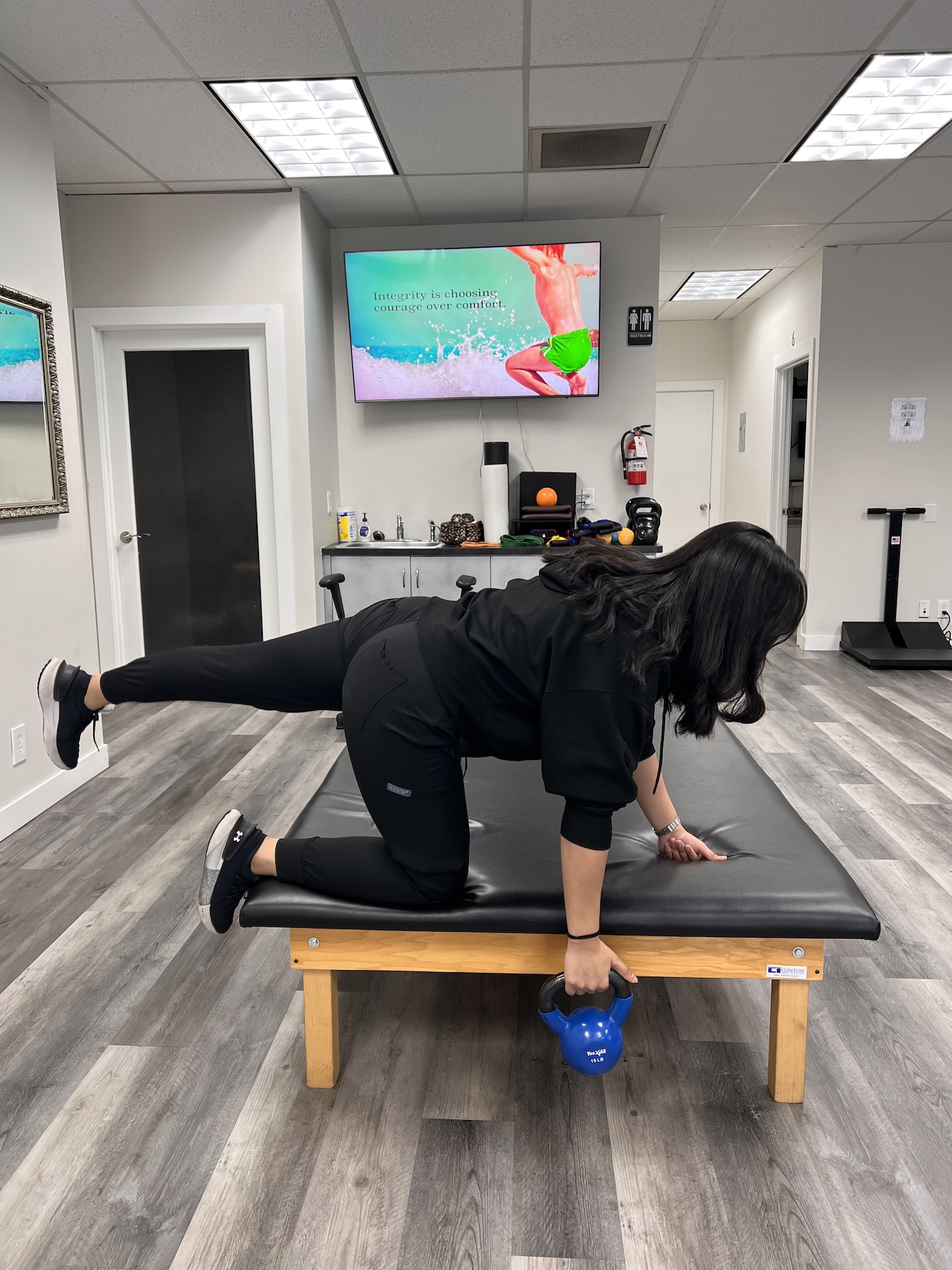 Patient doing a core exercise for back pain at Chiro 1st