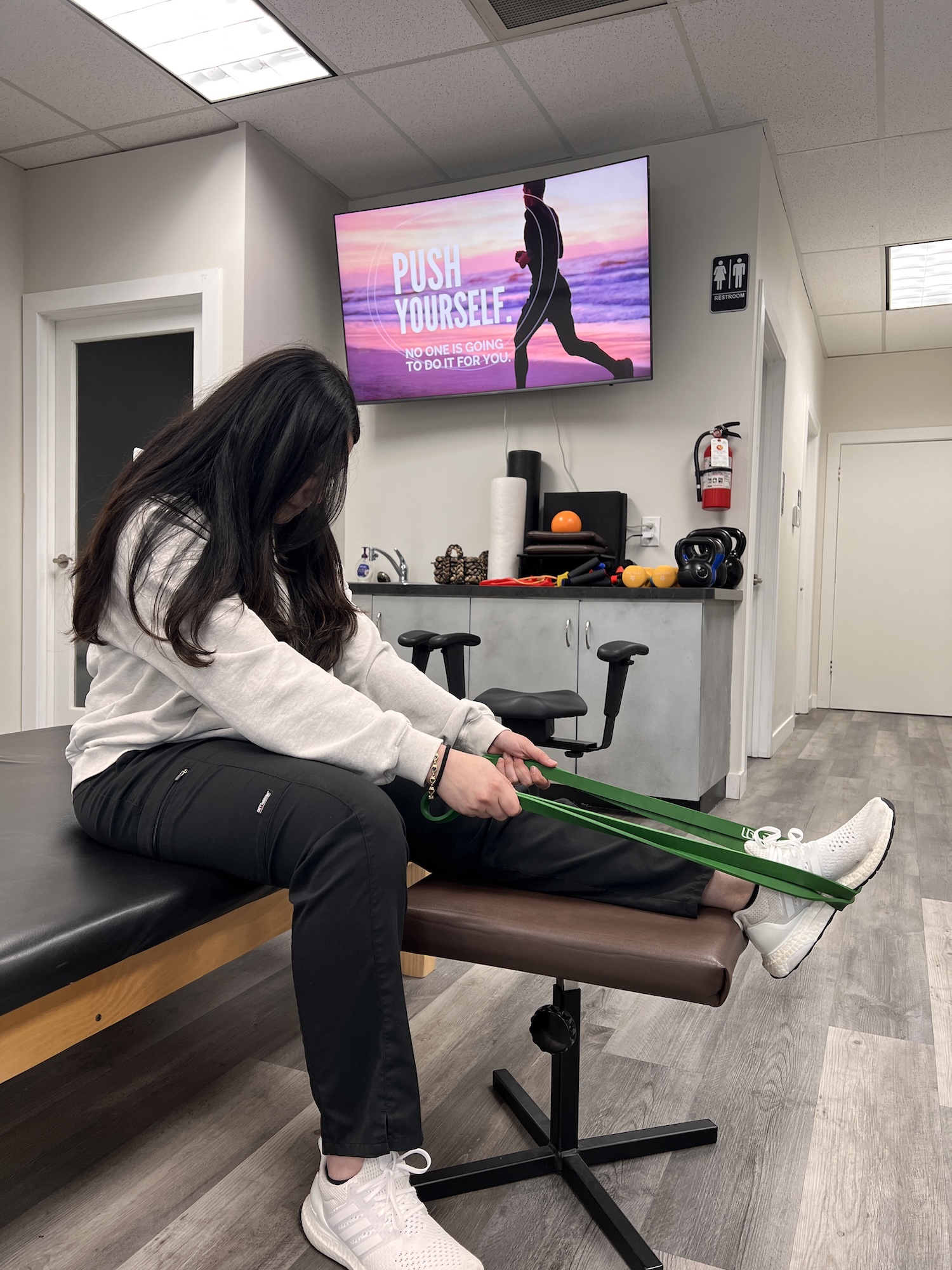 Patient doing a leg strengthening exercise for neuropathy at Chiro 1st