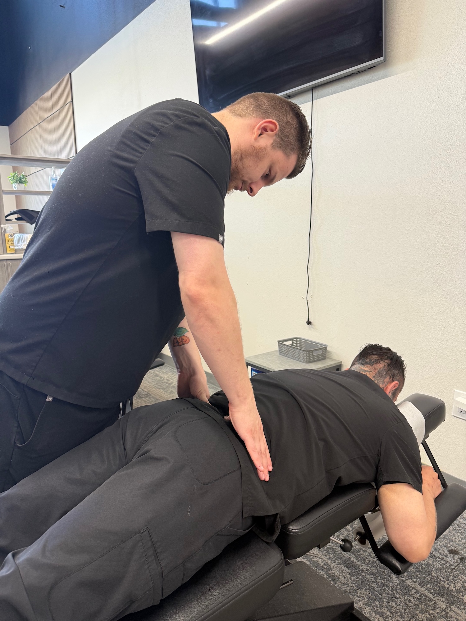 Chiropractor treating a patient with sciatica at Chiro 1st
