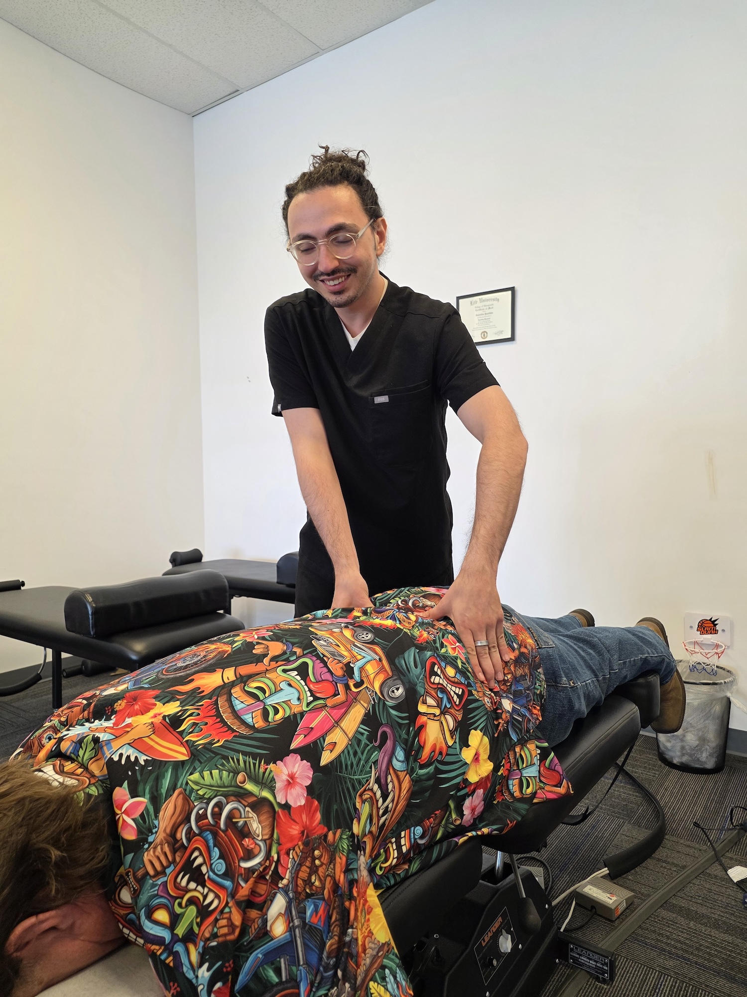Chiropractor treating low back pain before spinal decompression